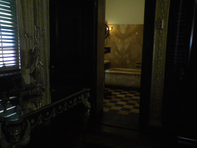 Marble bath tub seen through door opening